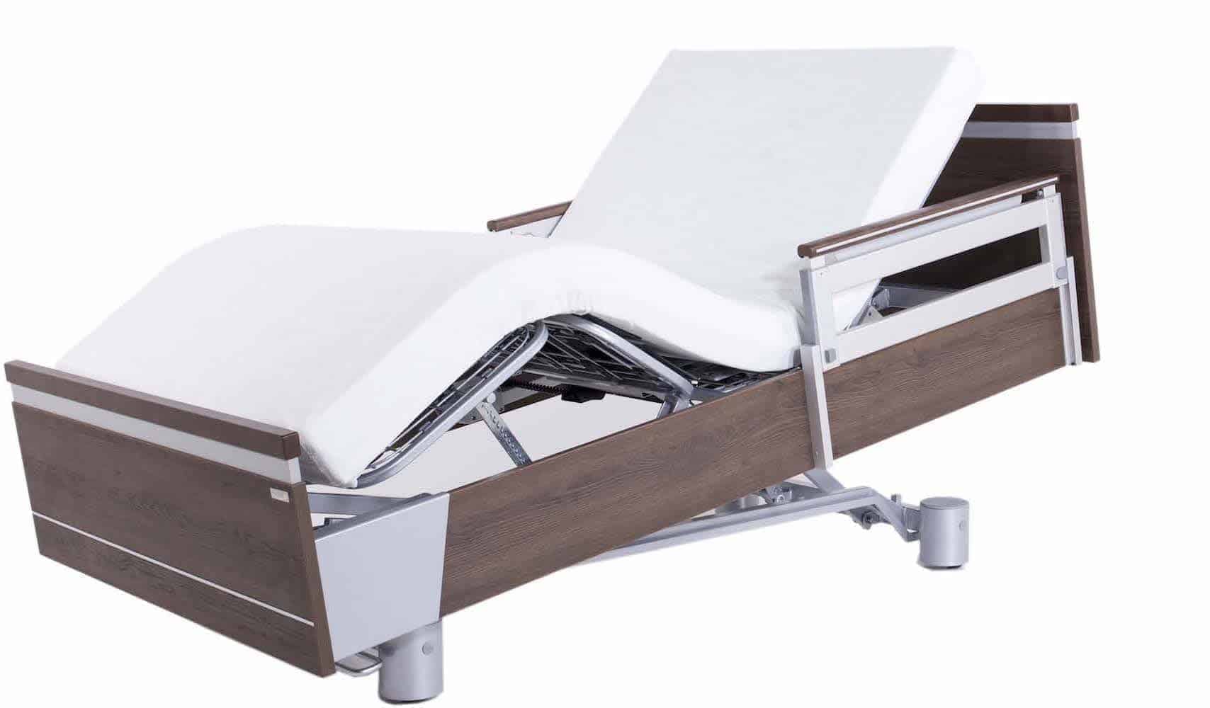 a hospital bed with a mattress on top of it.