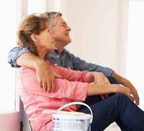a man and a woman sitting on a bench.