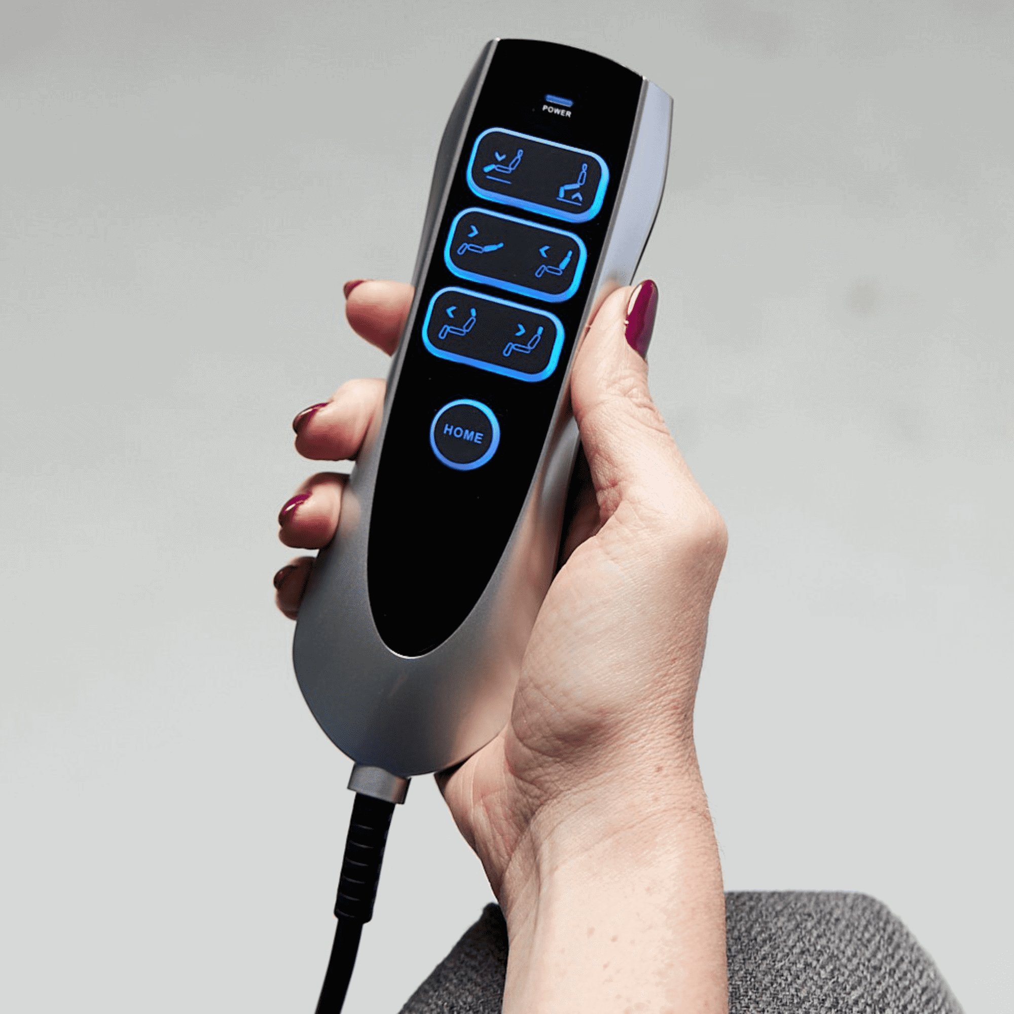 a woman holding a remote control in her hand.