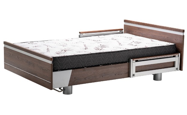 a bed with a wooden headboard and footboard.