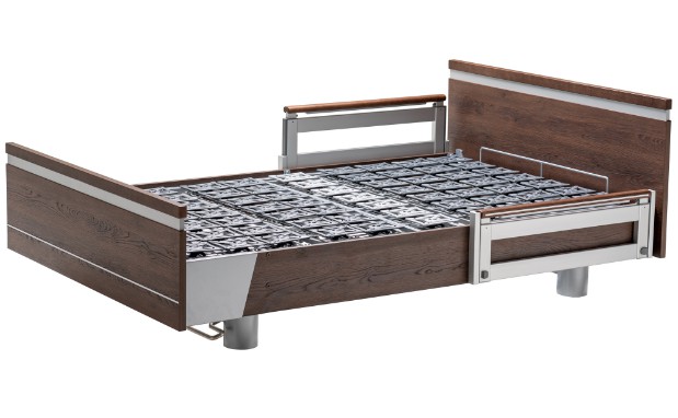 a bed with a wooden frame and metal rails.