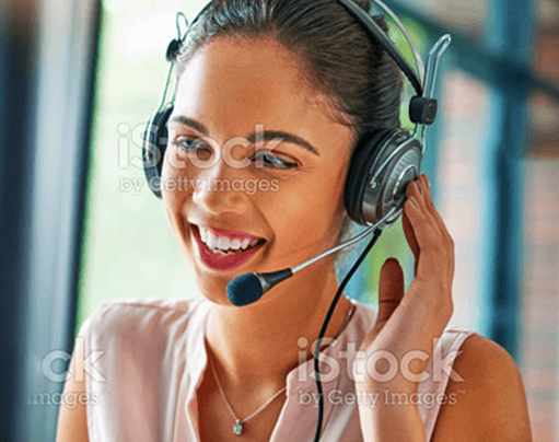 A smiling call center agent wearing a headset stock photo.