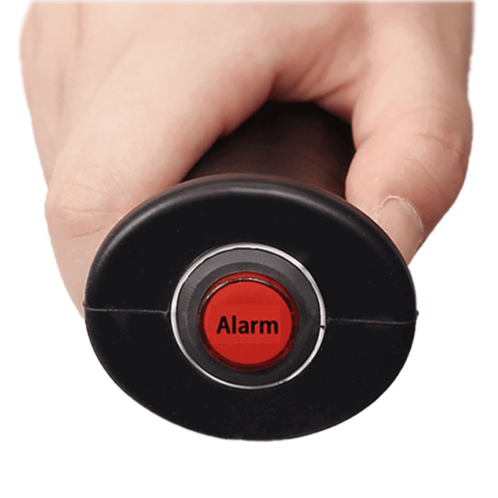 A person holding an alarm button.