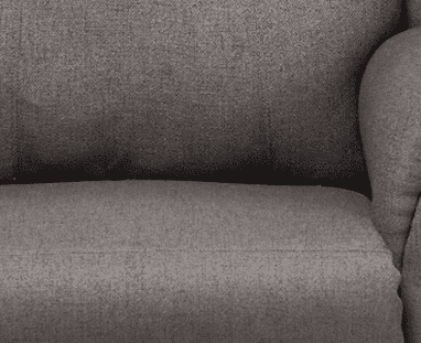 A close up image of a gray upholstered chair.