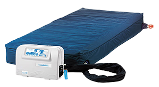An inflatable hospital bed mattress with a blue cover, connected to a white air pump control unit.
