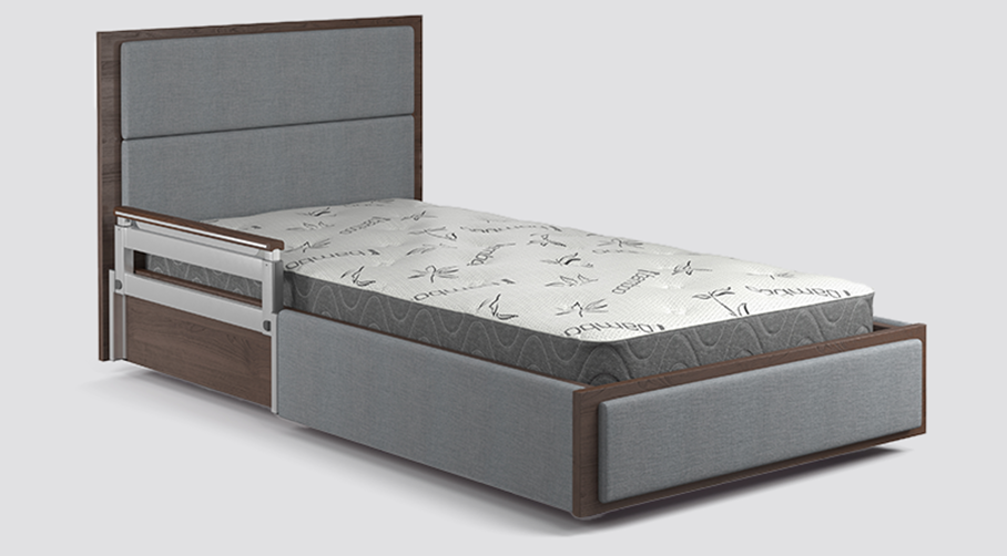 Single bed with a padded headboard and footboard, side safety rail, and a mattress featuring a patterned cover, all in gray and brown tones.